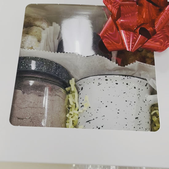 Hot chocolate kit! It comes with a Coffee mug, hot chocolate powder mix,  4 butter pecan cookies, 2 guava oatmeal cookies and 2 double chocolate cookies.